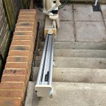 External stairlift at the bottom of steps showing track