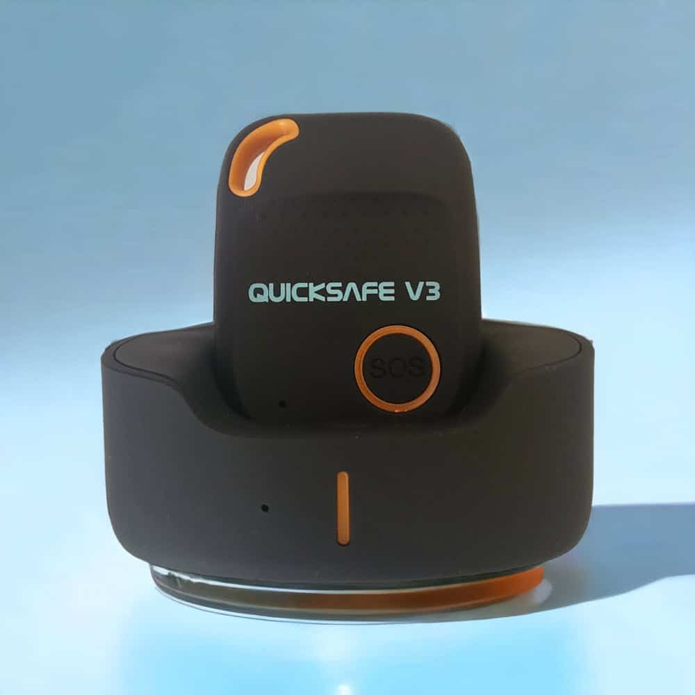 Quicksafe V3 panic alarm in its charging base