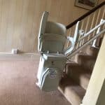 Prestige Stairlift on twin rail at the bottom of the stairs