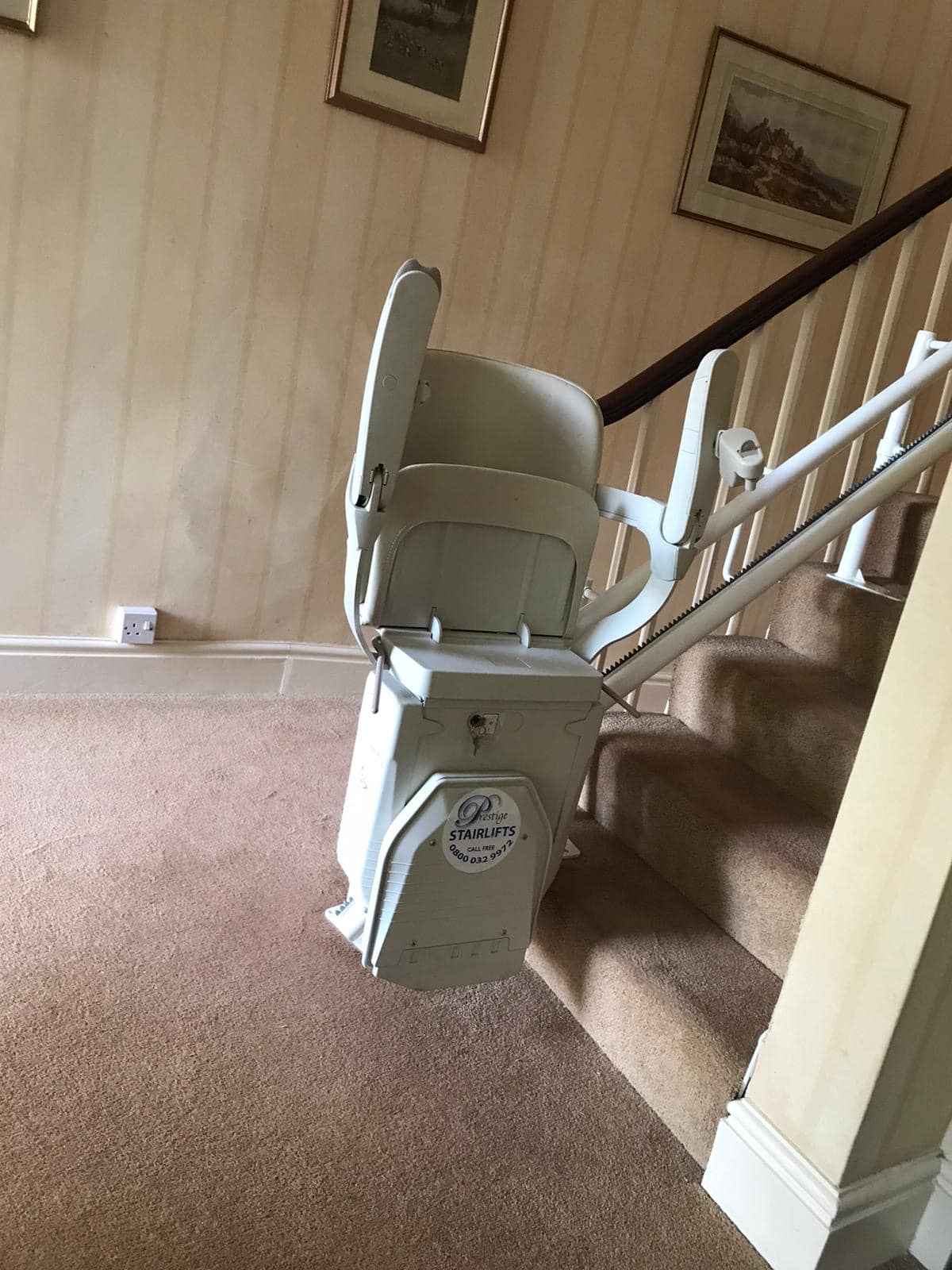Prestige Stairlift on twin rail at the bottom of the stairs