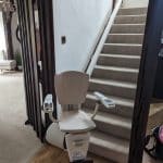 Stairlift at bottom of the stairs in swivel position