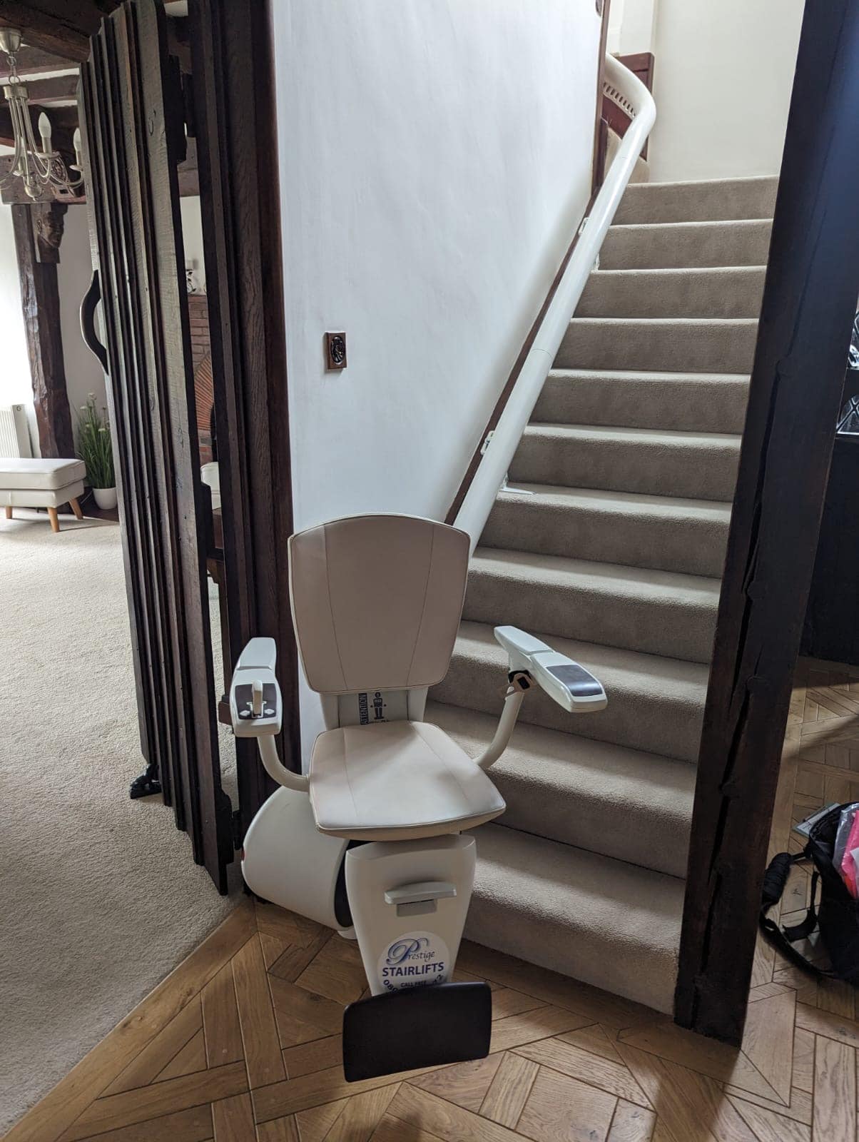 Stairlift at bottom of the stairs in swivel position