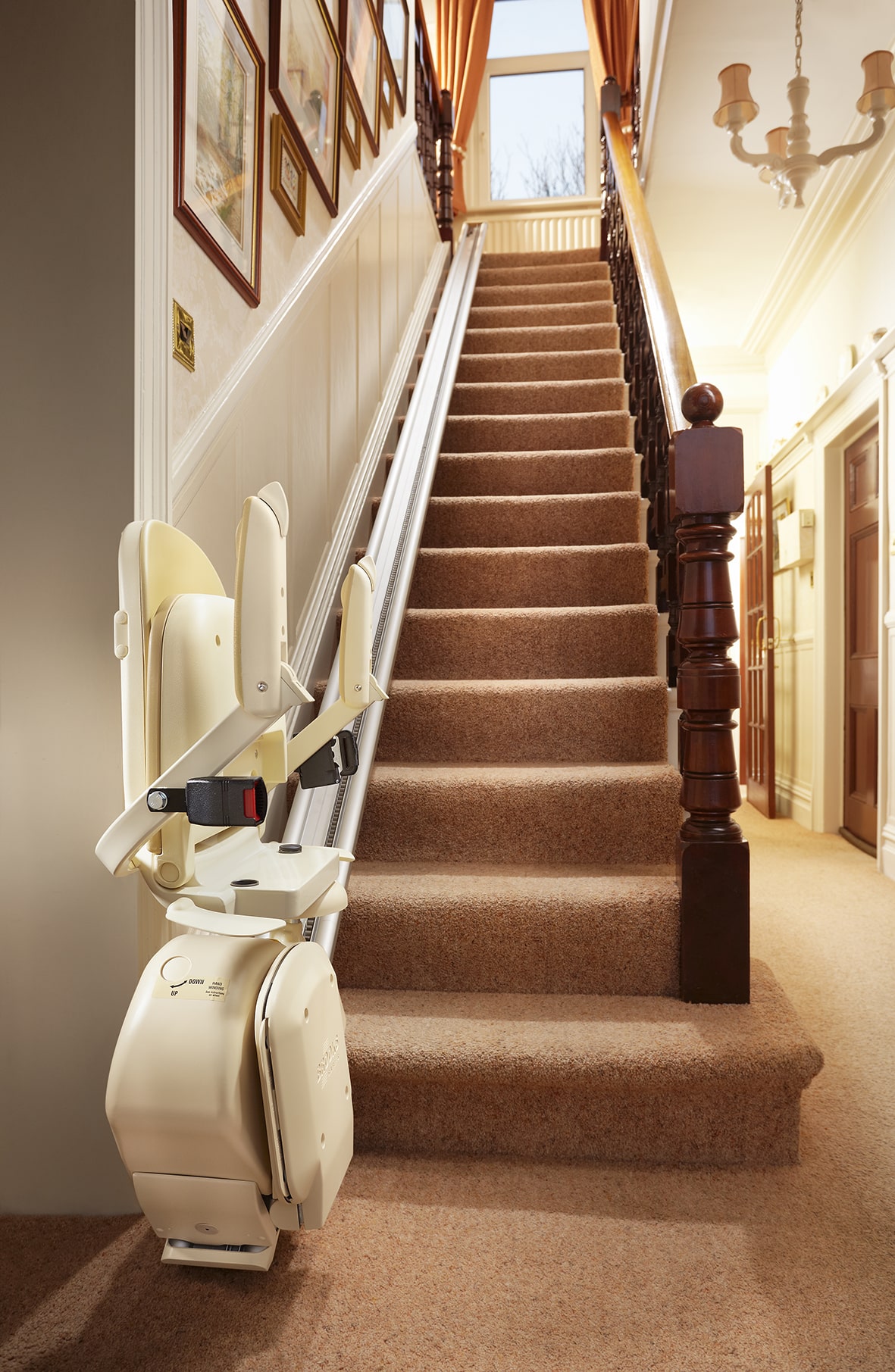 Prestige Brooks stairlift in foldaway position at the bottom of the stairs