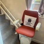 Prestige curved stairlift with a twin rail at the bottom of the stairs
