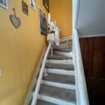 Stairlift shown on curved staircase