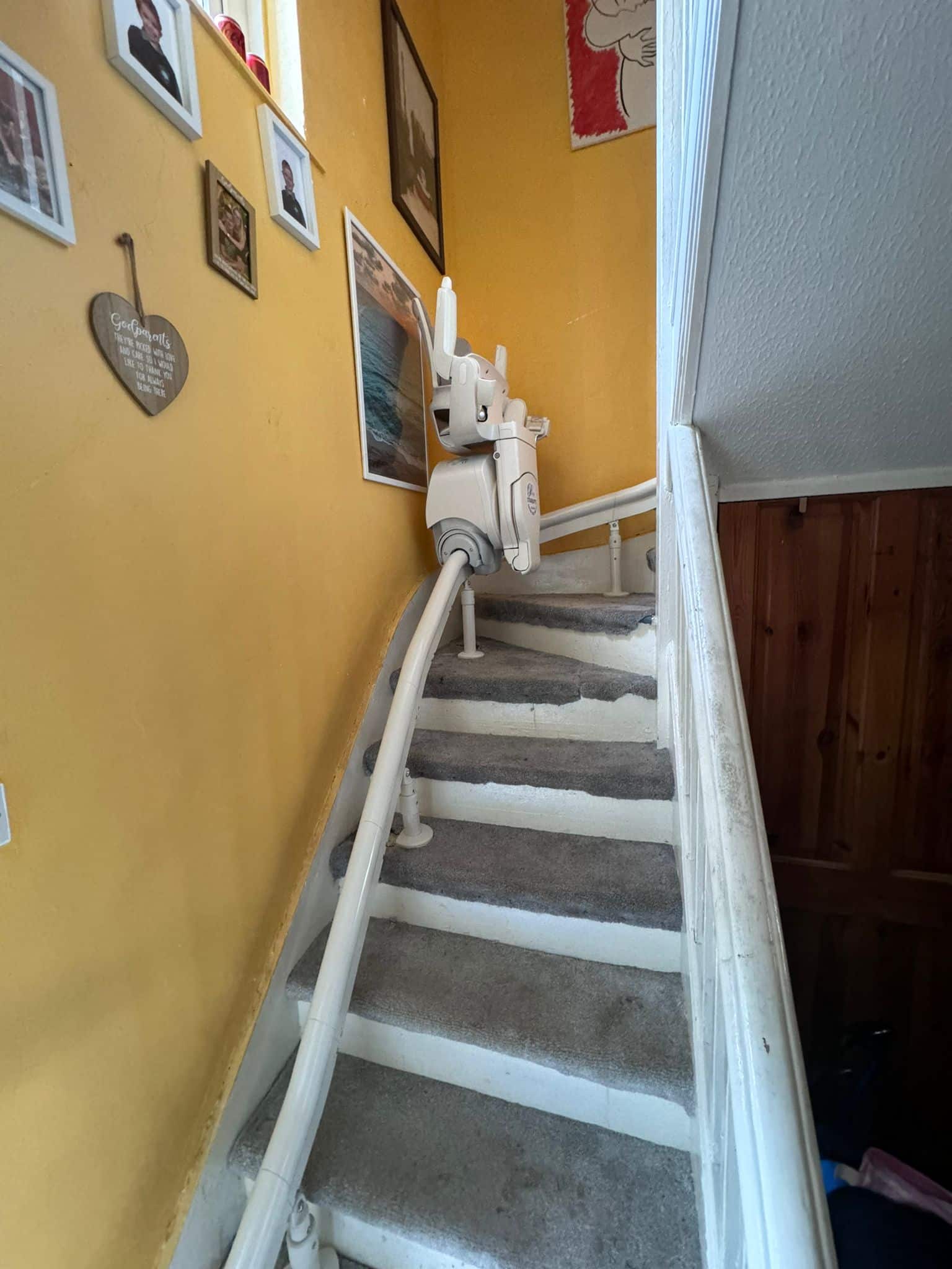 Stairlift shown on curved staircase