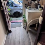 Image showing where the curved rail stops on the bottom stair