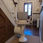 Otolift stairlift in ready position at the bottom of the stairs