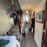 Customer testing their newly installed bespoke curved stairlift