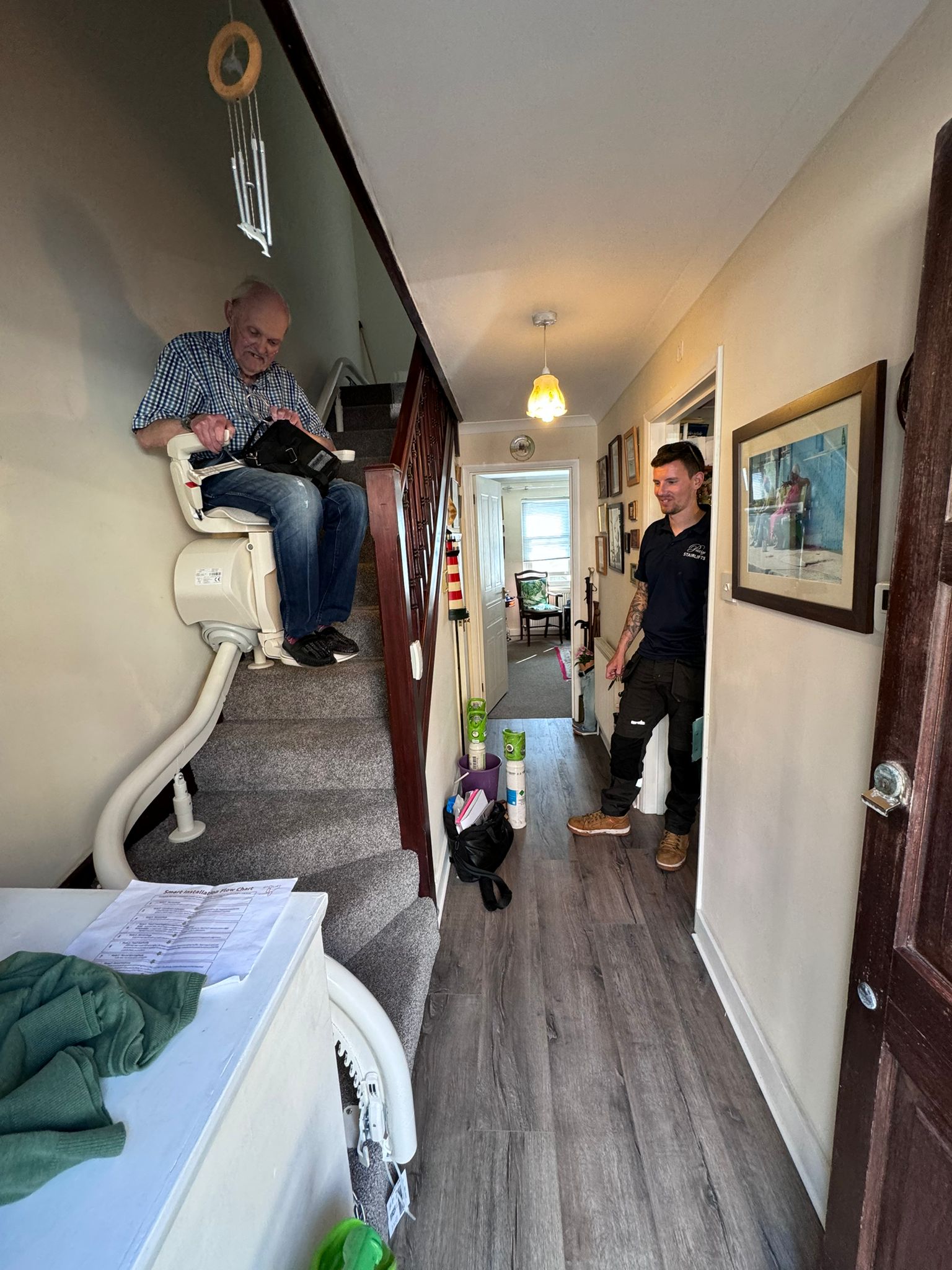 Customer testing their newly installed bespoke curved stairlift