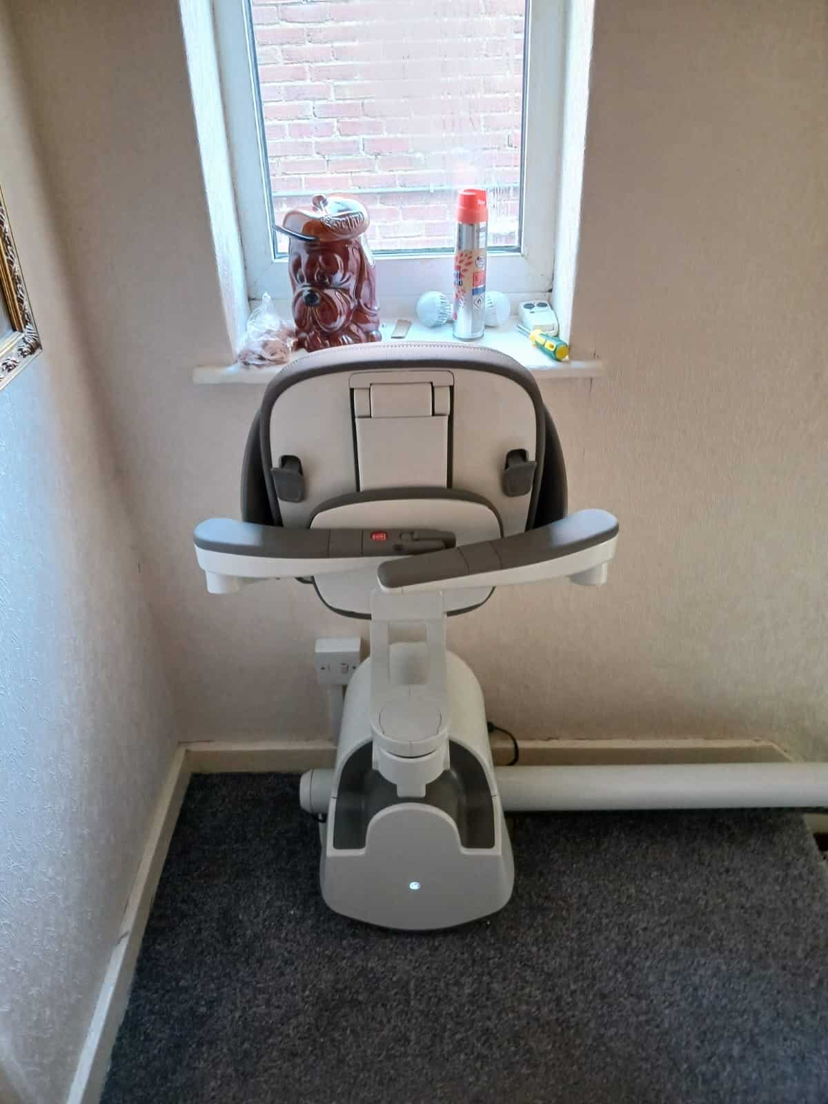 Flow stairlift in folded top of the stairs parking position