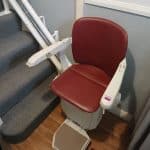 Stairlift at the bottom of the stairs in ready position