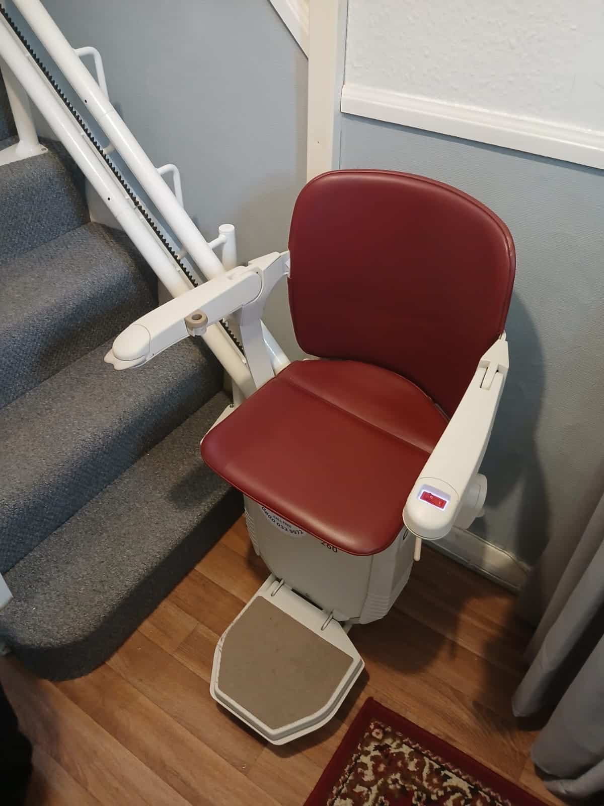 Stairlift at the bottom of the stairs in ready position